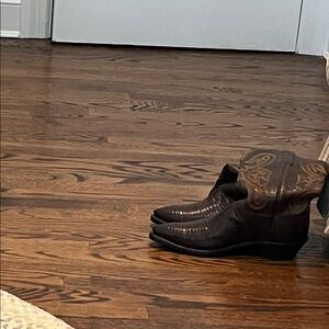 Lucchese 1883 brown cowboy boots with brown stitching. Retails for 1200.